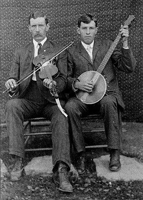 1918 - Josh Reed with fiddle and Henry Reed with banjo.